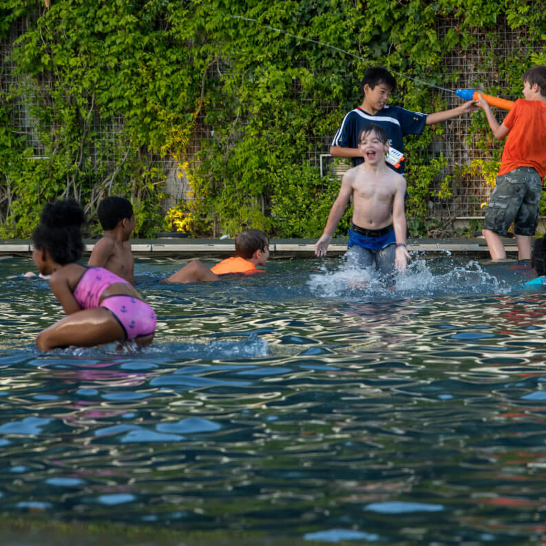 Kids splashing in a pool